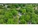 Expansive aerial view of a home nestled in a mature, lush, green neighborhood with private drive at 1816 Lisbon Ln, Charlotte, NC 28269