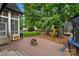 Brick patio featuring an outdoor kitchen and play area, perfect for Gathering fun and entertaining at 1816 Lisbon Ln, Charlotte, NC 28269