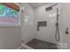 Modern shower featuring subway tile, glass door, and stylish fixtures at 1816 Lisbon Ln, Charlotte, NC 28269