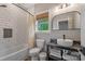 Bathroom featuring a subway tile shower-tub combo and modern sink at 1816 Lisbon Ln, Charlotte, NC 28269