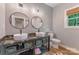 Bright bathroom featuring dual sinks, round mirrors, and lots of storage at 1816 Lisbon Ln, Charlotte, NC 28269