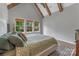Light-filled bedroom with vaulted ceiling, natural light, and hardwood floors at 1816 Lisbon Ln, Charlotte, NC 28269