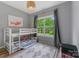 Bright bedroom with bunkbeds, patterned rug, and natural light at 1816 Lisbon Ln, Charlotte, NC 28269