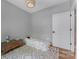 Cozy bedroom features hardwood floors, globe, chest, and neutral decor at 1816 Lisbon Ln, Charlotte, NC 28269