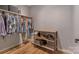 Walk-in closet with clothing rack and shoe storage on wood floor at 1816 Lisbon Ln, Charlotte, NC 28269