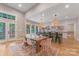 Bright open dining and kitchen area with large dining table and hardwood floors at 1816 Lisbon Ln, Charlotte, NC 28269