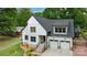 Charming two-story home with modern black trim and a two-car attached garage at 1816 Lisbon Ln, Charlotte, NC 28269