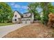 Charming two-story home with modern black trim and a two-car attached garage at 1816 Lisbon Ln, Charlotte, NC 28269