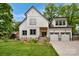 Charming two-story home with a two-car garage, featuring a manicured lawn and inviting entrance at 1816 Lisbon Ln, Charlotte, NC 28269