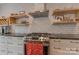 Modern kitchen with stainless steel appliances, white subway tiles, and open shelving at 1816 Lisbon Ln, Charlotte, NC 28269