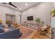 Inviting open floor plan living room with a fireplace, hardwood floors, and area rug at 1816 Lisbon Ln, Charlotte, NC 28269