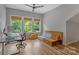 Sunlit home office with three windows, hardwood floors, and modern decor perfect for working from home at 1816 Lisbon Ln, Charlotte, NC 28269