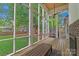 Charming screened porch with a view of the backyard, perfect for outdoor dining and relaxation at 1816 Lisbon Ln, Charlotte, NC 28269