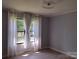 Bright bedroom with hardwood floors and natural light provides a comfortable retreat at 1820 Trinity Church Rd, Monroe, NC 28112