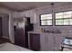 Bright kitchen featuring white cabinets, stainless steel appliances, and a modern countertop at 1820 Trinity Church Rd, Monroe, NC 28112