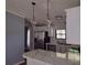 Bright kitchen featuring white cabinets, stainless steel appliances, and a modern countertop at 1820 Trinity Church Rd, Monroe, NC 28112