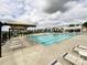 The community pool provides a perfect space for relaxation and recreation with an abundance of lounge seating at 1876 Yellow Daisy Dr, Matthews, NC 28104