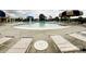 A community pool area with lounge chairs and a splash pad for a resort-style living experience at 1876 Yellow Daisy Dr, Matthews, NC 28104