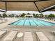 The large community pool has many lounge chairs and lane markers to provide a place to relax and exercise at 1876 Yellow Daisy Dr, Matthews, NC 28104