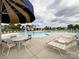 The community pool features plenty of seating and umbrellas for a relaxing day in the sun at 1876 Yellow Daisy Dr, Matthews, NC 28104