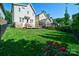Large backyard with beautiful green grass and spacious deck area, great for entertaining at 1909 Summey Ave, Charlotte, NC 28205