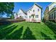 Beautiful backyard with large grassy area, deck with staircase, and privacy fence at 1909 Summey Ave, Charlotte, NC 28205