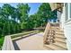 A large outdoor deck overlooking a green, tree-filled backyard at 1909 Summey Ave, Charlotte, NC 28205