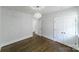 Bedroom featuring hardwood floors, closet and decorative light fixture at 1909 Summey Ave, Charlotte, NC 28205
