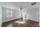 Spacious bedroom with hardwood floors and abundant natural light, creating a warm and inviting atmosphere at 1909 Summey Ave, Charlotte, NC 28205