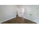 Bedroom with hardwood floors and white trim features multiple door and closet options at 1909 Summey Ave, Charlotte, NC 28205