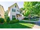 Charming two-story home with attached garage, well-manicured landscaping, and inviting curb appeal at 1909 Summey Ave, Charlotte, NC 28205