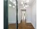 Elegant foyer features hardwood floors, a modern light fixture, and an inviting view of the home's interior at 1909 Summey Ave, Charlotte, NC 28205