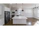 Bright, modern kitchen with white cabinets, stainless steel appliances, and a spacious center island at 1909 Summey Ave, Charlotte, NC 28205
