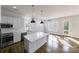 Bright, modern kitchen with white cabinetry, stainless steel appliances, and a large center island at 1909 Summey Ave, Charlotte, NC 28205