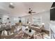 Bright open-concept living room featuring a dining area, modern furnishings, and beautiful hardwood floors at 1909 Summey Ave, Charlotte, NC 28205