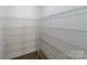 Walk-in pantry featuring custom metal shelving and providing ample storage space at 1909 Summey Ave, Charlotte, NC 28205