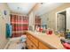 Functional bathroom features a large mirror, tile floors, and a shower with a curtain at 195 Kings Ter, Salisbury, NC 28146