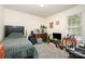 Relaxed bedroom with a guitar, terrariums, and a window providing natural light at 195 Kings Ter, Salisbury, NC 28146