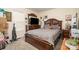 Inviting bedroom with a wooden bed frame, carpet floors, and TV on wooden dresser at 195 Kings Ter, Salisbury, NC 28146