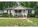 Charming single-story home with a cozy front porch, mature landscaping, and a well-maintained lawn at 195 Kings Ter, Salisbury, NC 28146