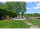 Private backyard oasis with fire pit, chairs, and scenic lake views at 19501 River Falls Dr, Davidson, NC 28036