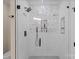 Stylish bathroom with glass-enclosed shower, rainfall shower head and white subway tile at 19501 River Falls Dr, Davidson, NC 28036