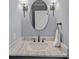 Stylish bathroom with marble countertop, modern fixtures, and elegant design, offering a luxurious experience at 19501 River Falls Dr, Davidson, NC 28036