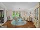 Bright dining room featuring a glass table, stylish chairs and a scenic view at 19501 River Falls Dr, Davidson, NC 28036