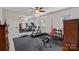 Spacious exercise room with mirrored wall and treadmill, perfect for a home fitness setup at 19501 River Falls Dr, Davidson, NC 28036