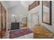 Grand foyer with marble floors, soaring ceilings, and elegant furnishings at 19501 River Falls Dr, Davidson, NC 28036