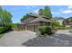 Spacious three-car garage with stone facade and manicured landscaping at 19501 River Falls Dr, Davidson, NC 28036