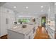Spacious kitchen with white cabinets, granite countertops, stainless steel appliances, and wood floors at 19501 River Falls Dr, Davidson, NC 28036