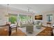 Bright living room with hardwood floors, large windows, comfortable seating, and a view at 19501 River Falls Dr, Davidson, NC 28036