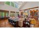 Bright living room with stone fireplace, vaulted ceilings, and French doors at 19501 River Falls Dr, Davidson, NC 28036